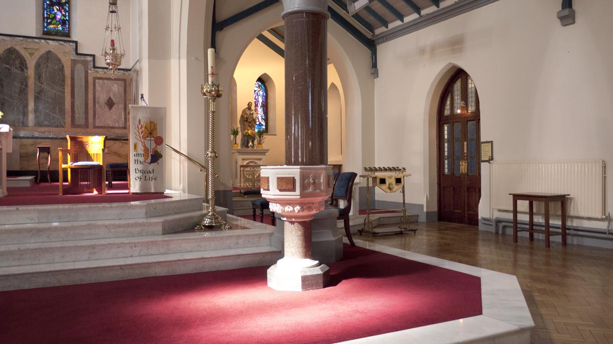 Baptismal font and Easter candle