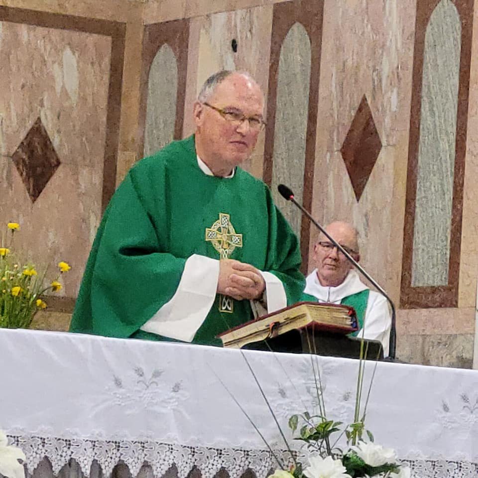 Fr. Alois celebrates his last Mass as Fr. David looks on